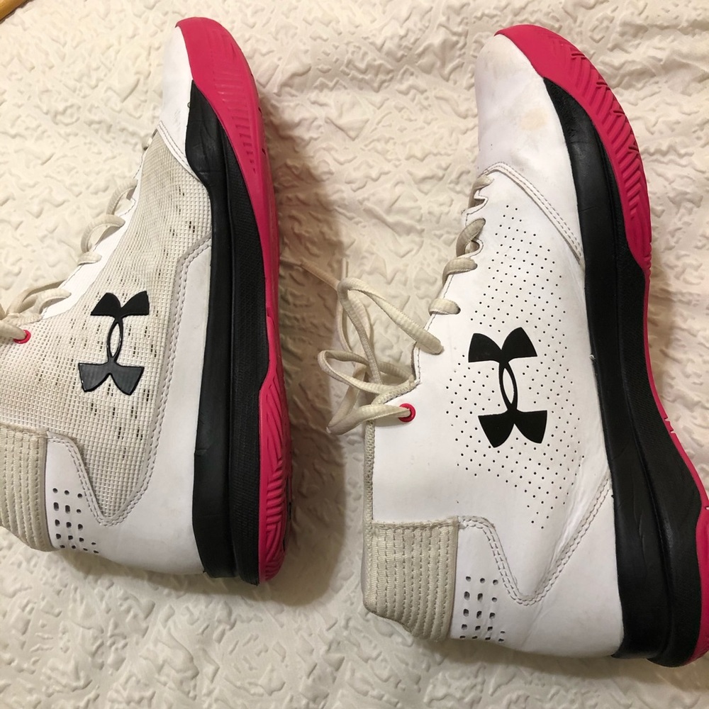 White and pink Under Armour basketball shoes